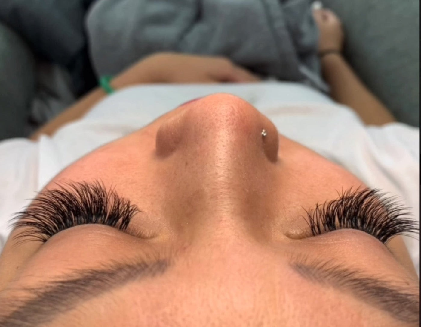 A client with a full, dark set of volume lash extensions
